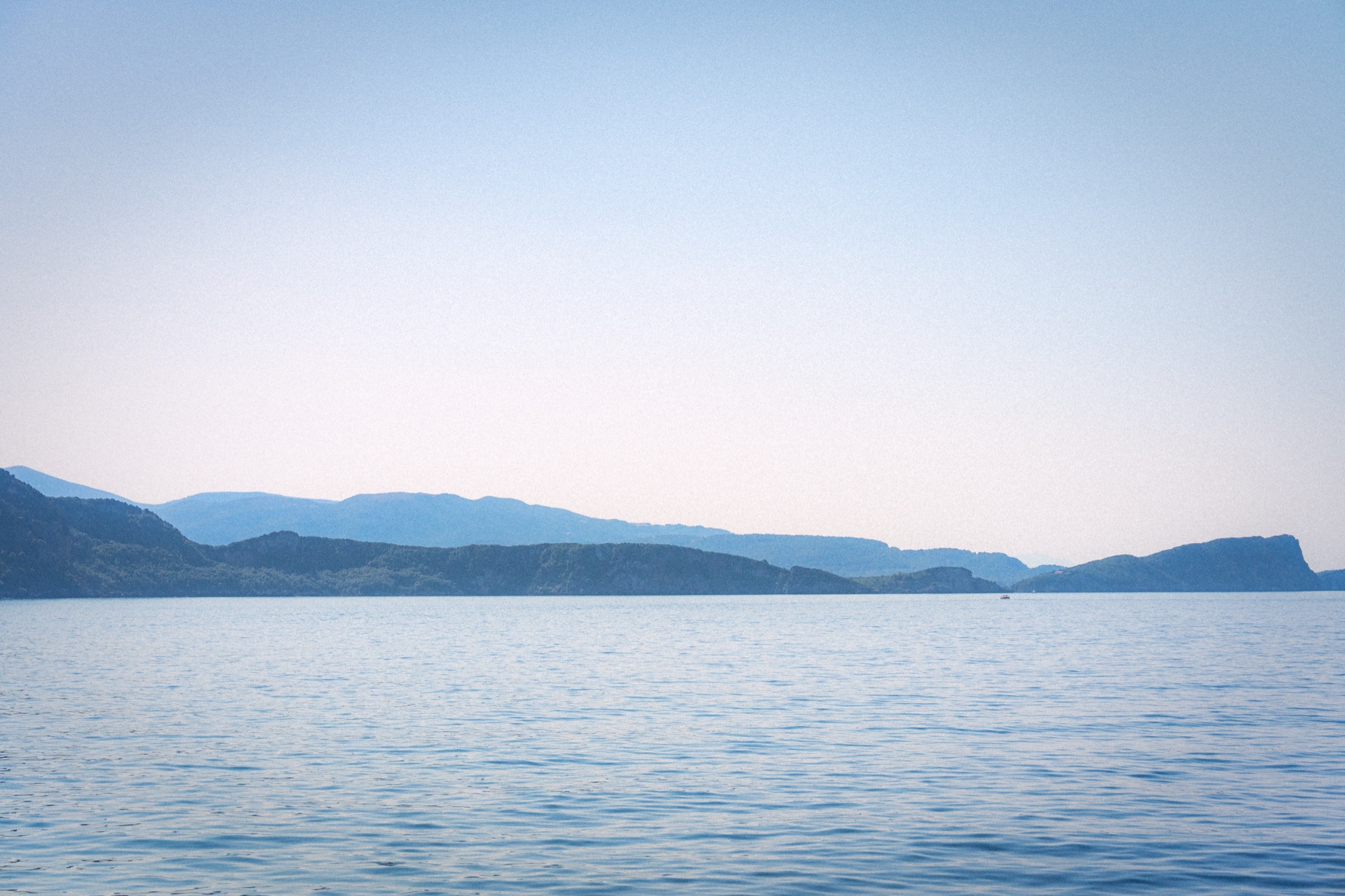 Serene mountain coastline at dusk