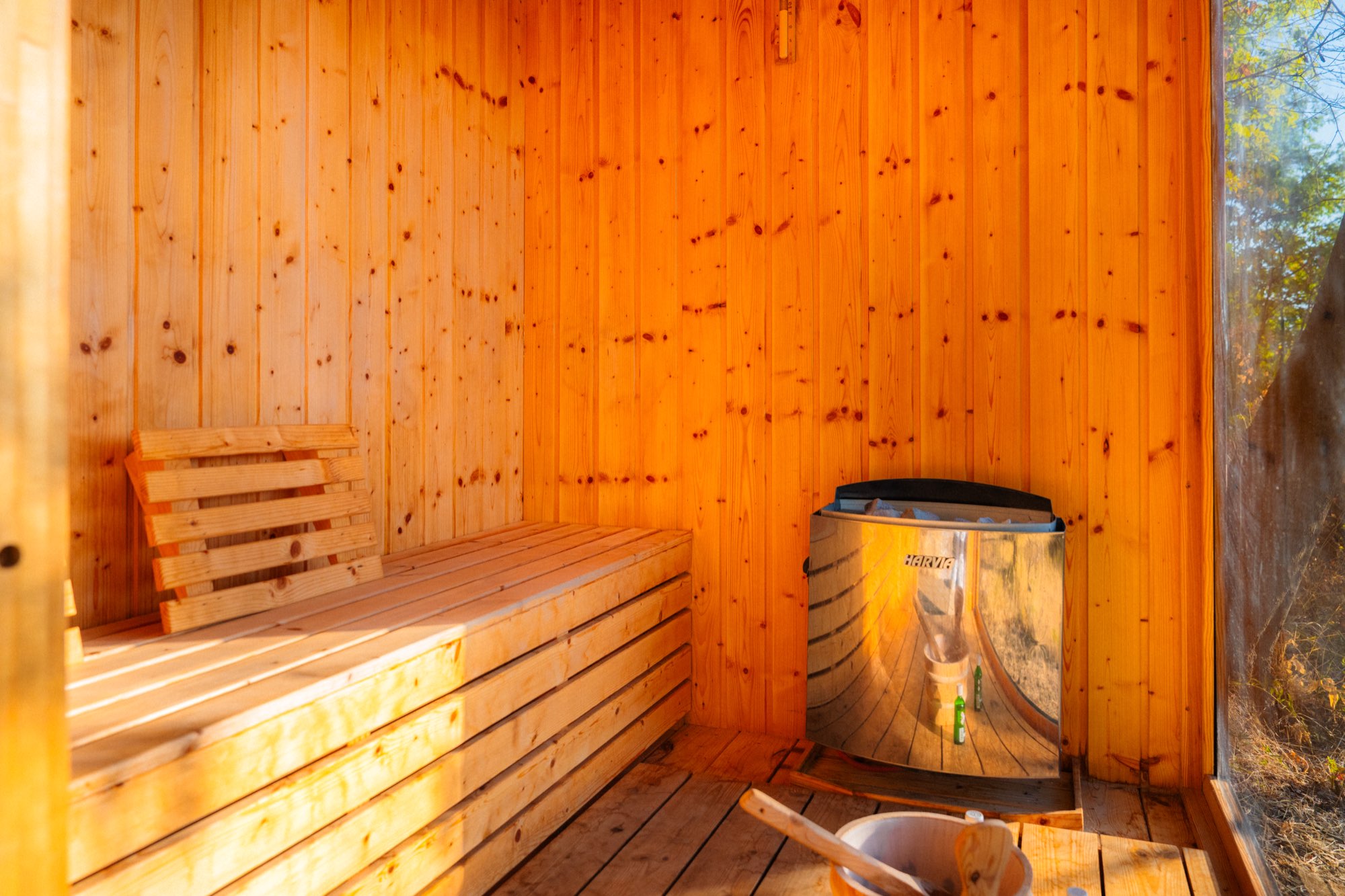 Sauna interior with timber benches and the stove