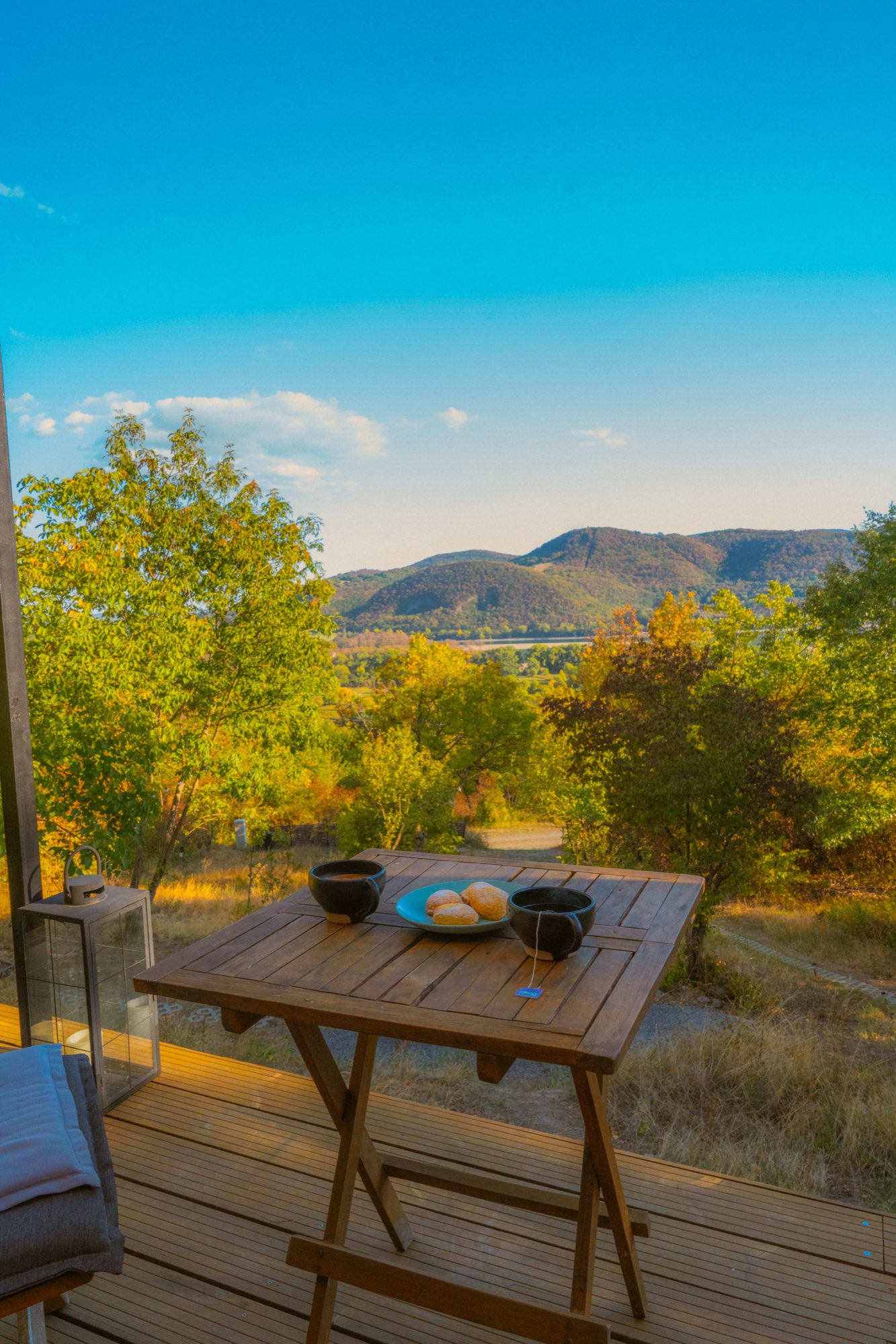 Breakfast laid out on the deck table above the valley
